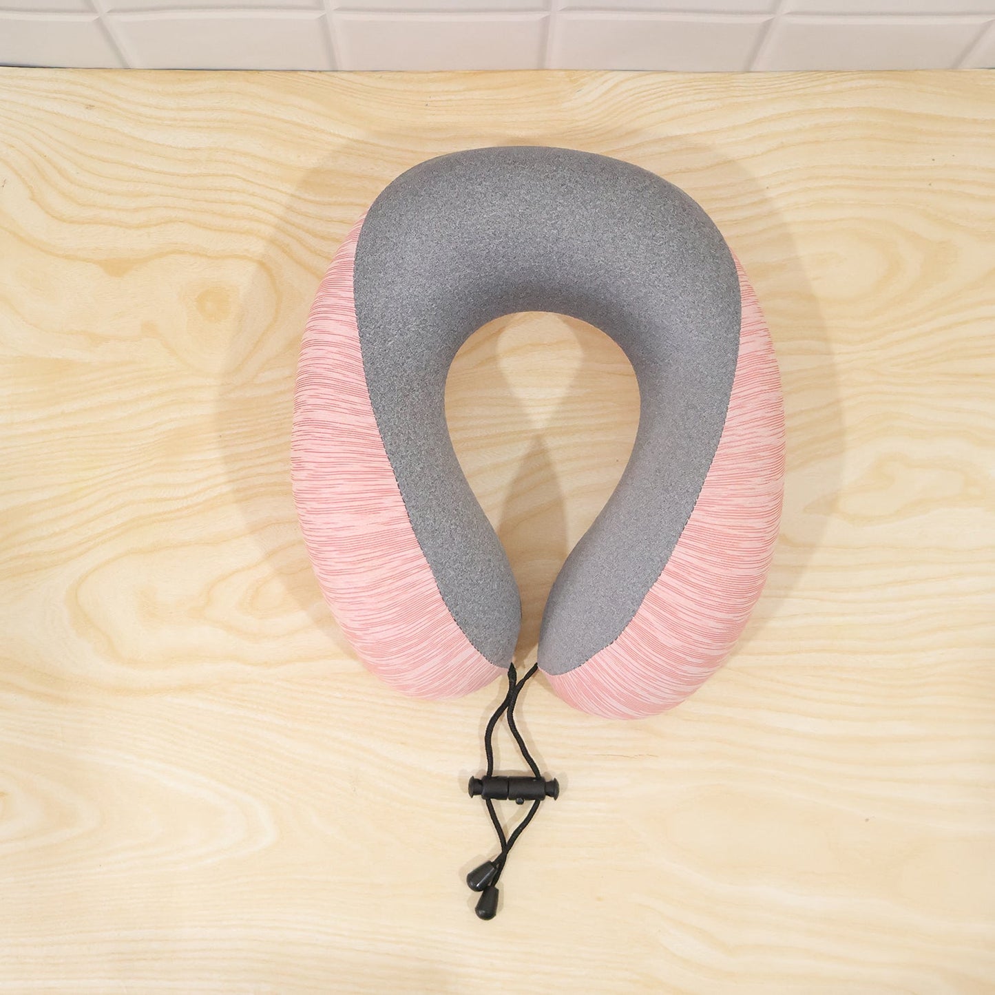 Lightweight pink and grey U shaped pillow for restful travel