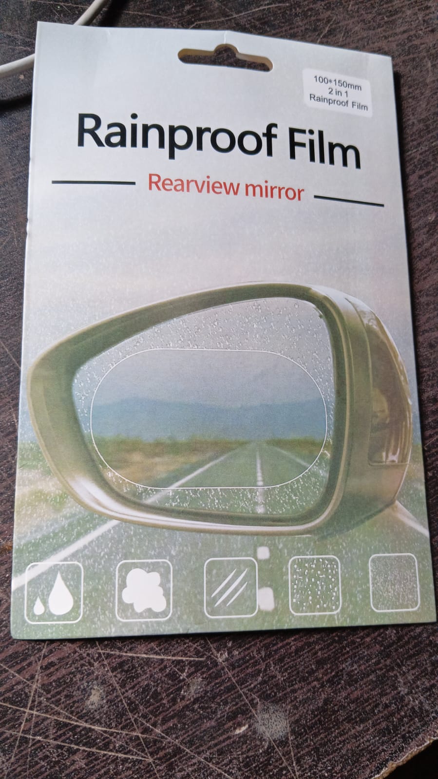 Product image of the car mirror anti fog film, ready for installation.
