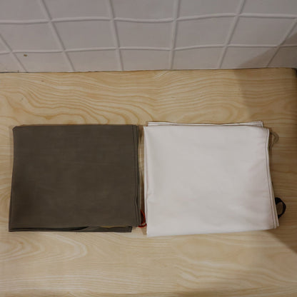 The versatile kitchen apron neatly packaged, ready for daily home or commercial use.