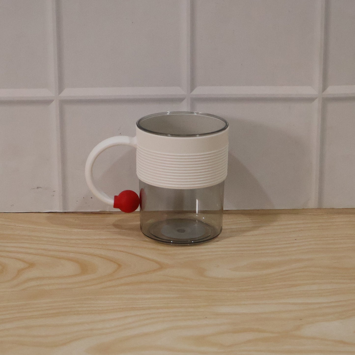 Packaged box containing stylish transparent plastic coffee mugs.