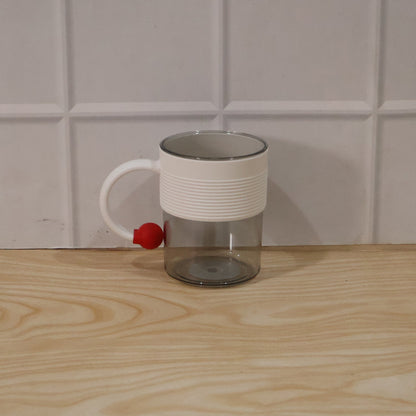 Packaged box containing stylish transparent plastic coffee mugs.