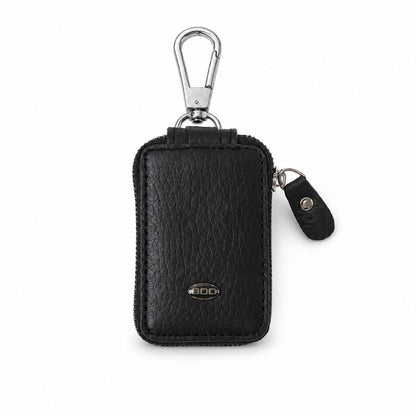Elegant black PU leather car key case on white background.