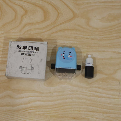 Live photo of kids multiplication roller stamp with box and ink bottle