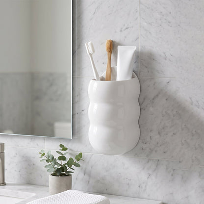 Wall-mounted caterpillar storage holder used for toothbrushes and toothpaste