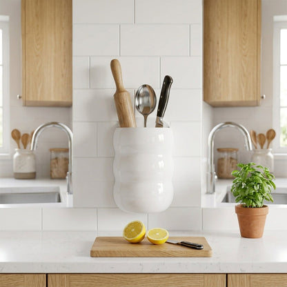 Wall-mounted caterpillar storage holder used for kitchen tools