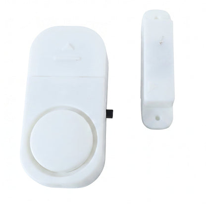 Door alarm sensor and magnet pair on white background