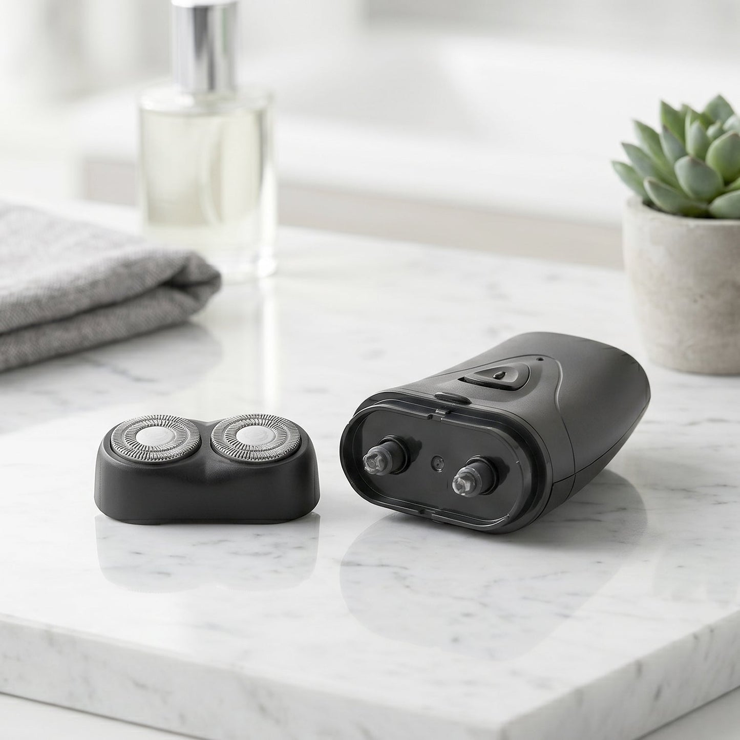 Portable electric shaver in hand showing compact size and sleek design