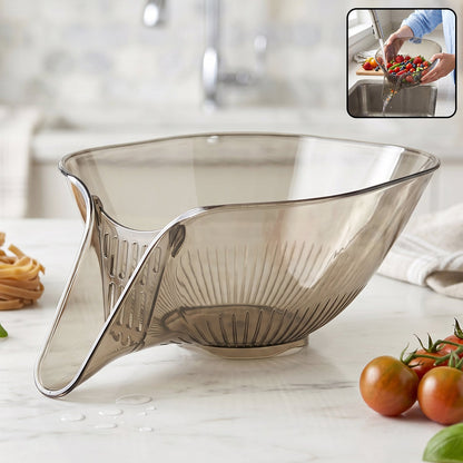 Hand holding the multipurpose fruit vegetable strainer rinsing fresh berries.