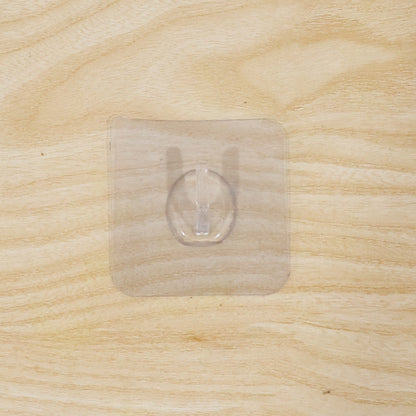Wall hook on wooden door with transparent adhesive