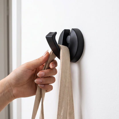 Screw mounted folding hook for robes, bags and umbrellas