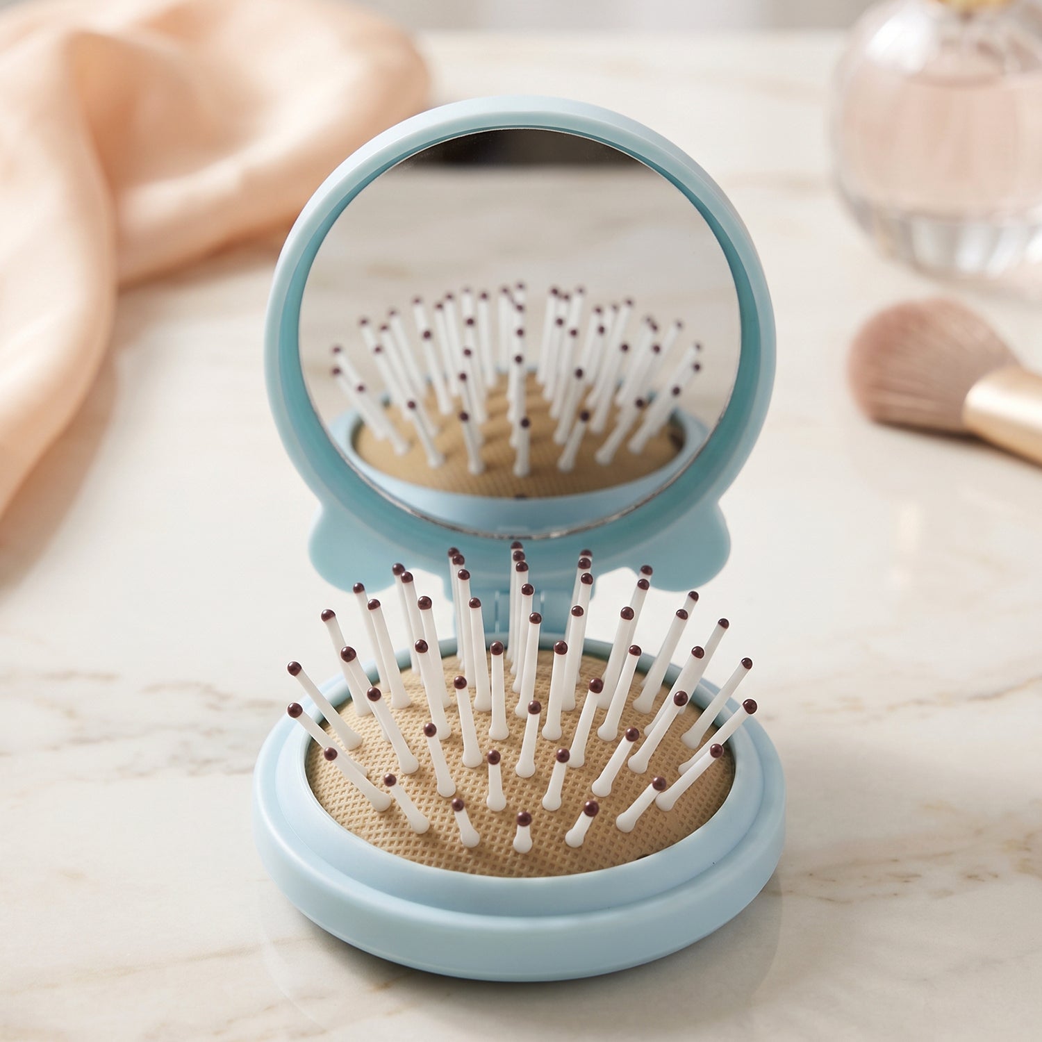 Space saving folding brush with mirror for men and women
