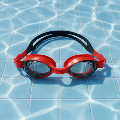 Detailed look at red swimming goggles emphasizing anti-fog lenses