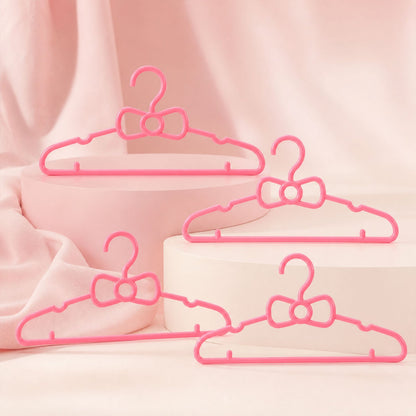 Children's wardrobe hangers with bow detail for small garments